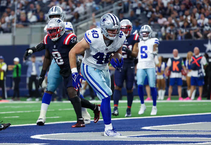 Oct 1, 2023; Arlington, Texas, USA; Dallas Cowboys running back Hunter Luepke (40) scores a touchdown during the second half against the New England Patriots at AT&T Stadium.